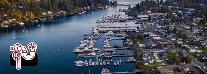 Gig Harbor, WA, an aerial view of the harbor and coastline showing many boats on the water and the Swift Plumbing logo